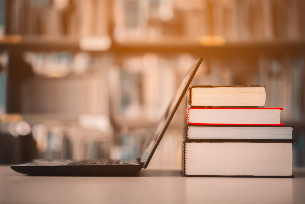 Laptop up against books