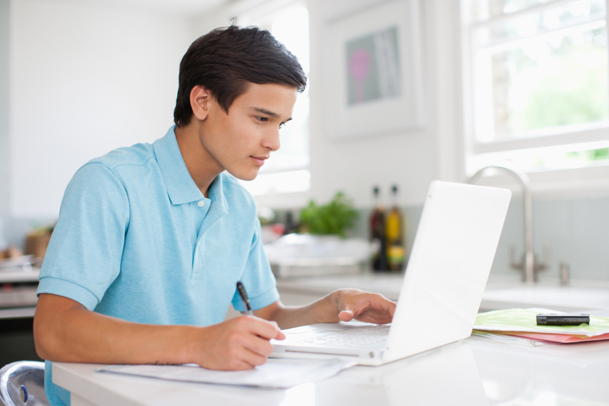 Student Learning at home on his computer