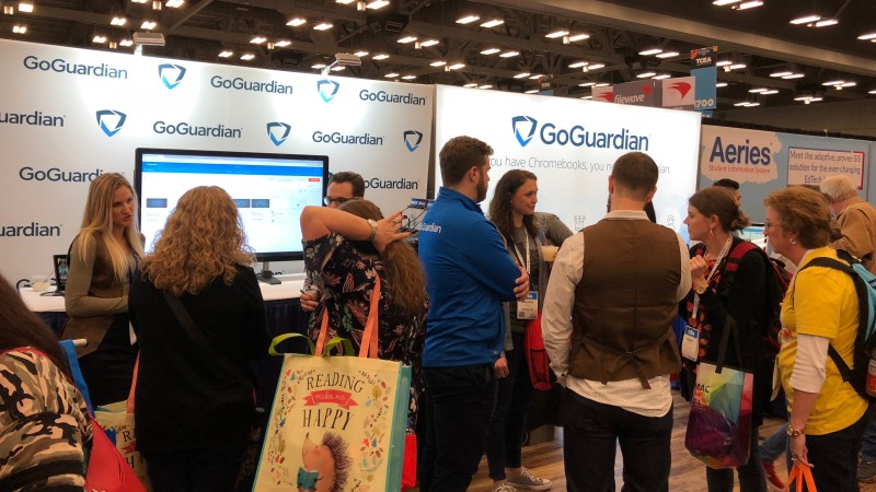 People at the GoGuardian tradeshow booth