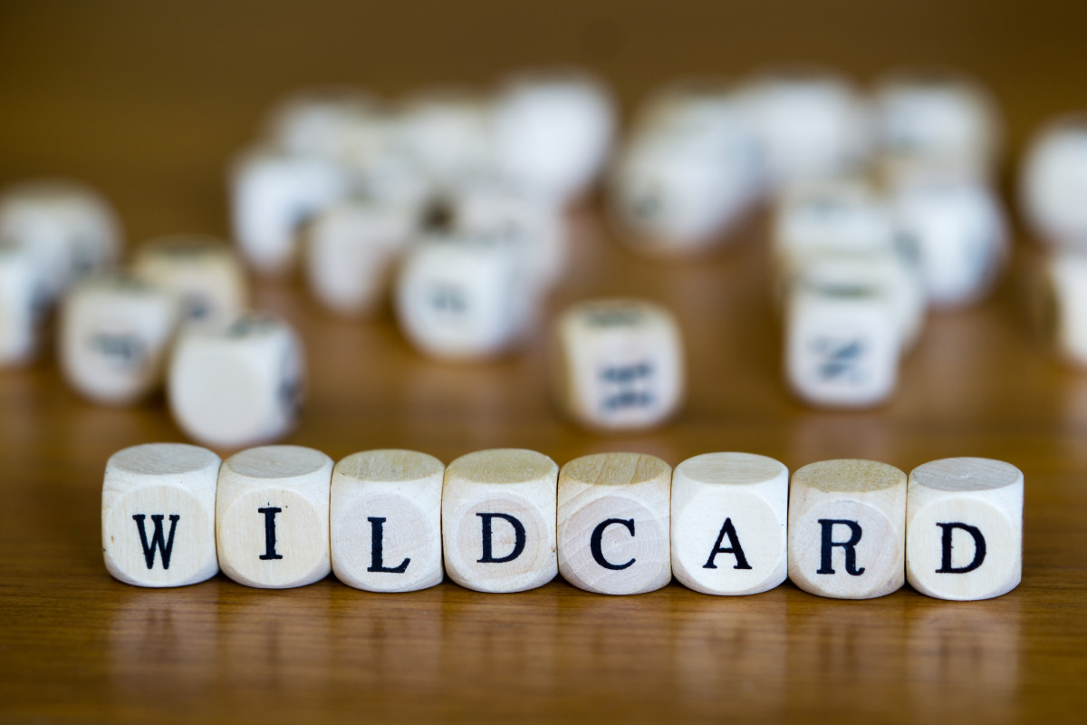 Dice spelling out "Wildcard"