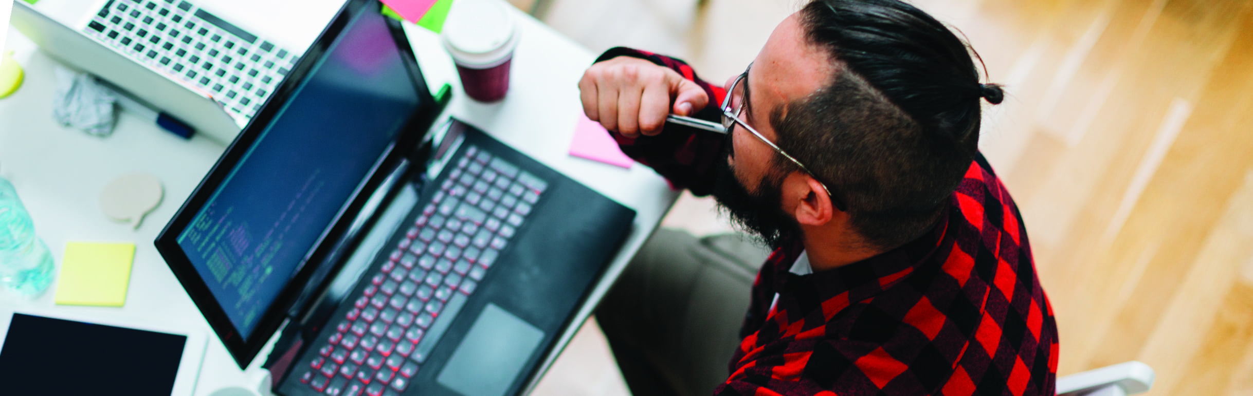 A man works on a laptop