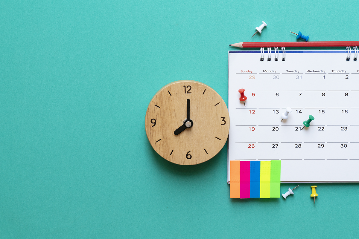 Clock and calendar with dates marked with post-its